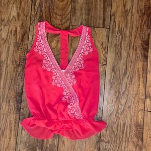 Pink tank top with white embroidery from Rorybeca